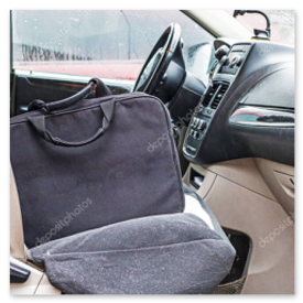 Laptop bag and accessories laid out on a surface