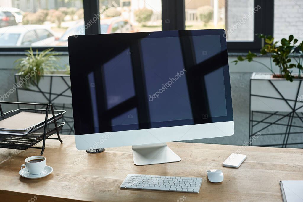 Business workstation with desktop, monitor, and keyboard